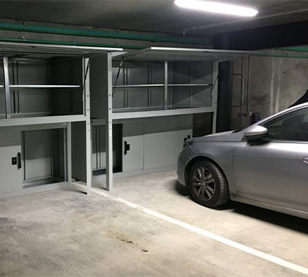 Metal overhead parking garage locker with stand