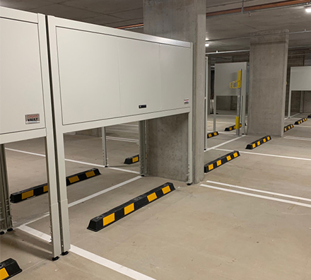 Metal overhead parking garage locker with stand